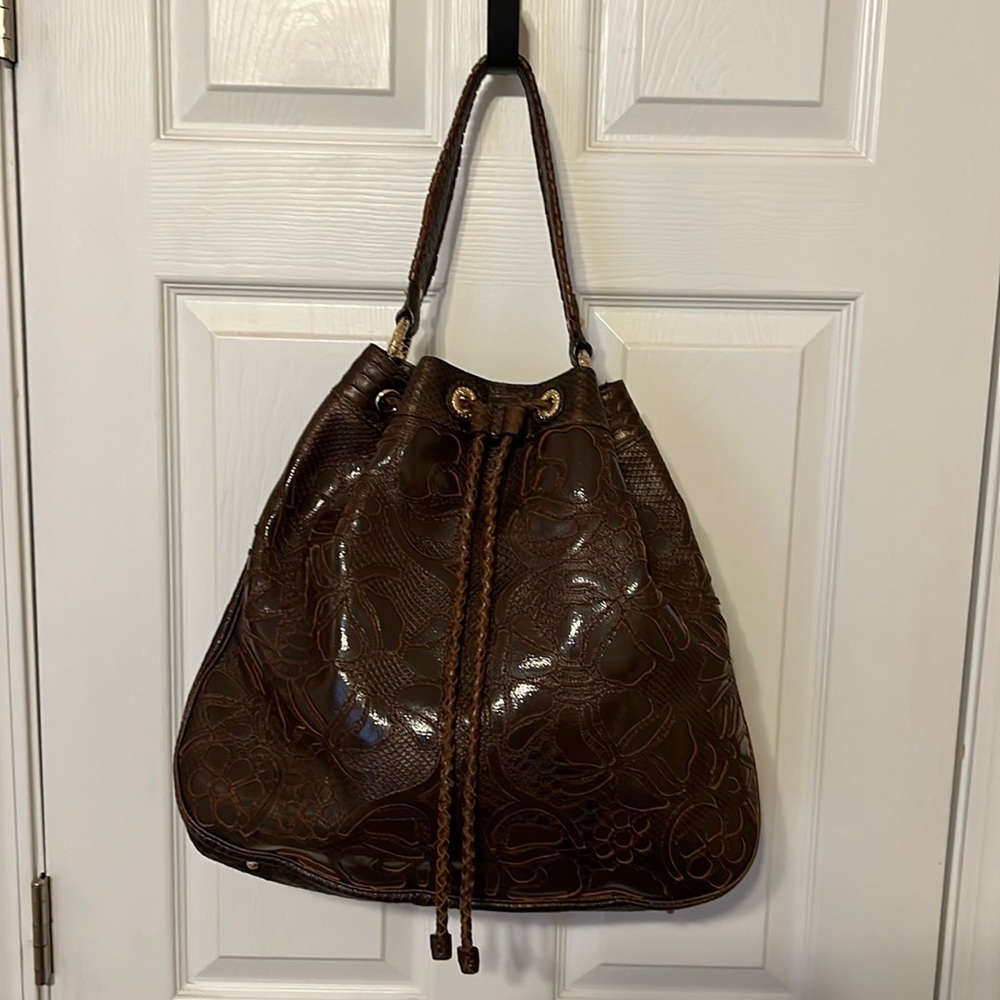 Excellent condition, large brown leather embossed drawstring purse.